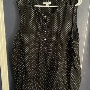 Sleeveless black and white polka dot shirt with buttons